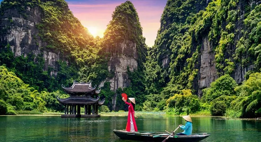 Trang An is a scenic area near Ninh Binh, Vietnam renowned for its boat cave tours.